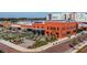 Exterior view of Heights Public Market with outdoor seating and brick architecture in a mixed-use development at 1108 W Charter St, Tampa, FL 33602