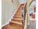 Detailed staircase with artistic wood-carved posts and a view to other rooms at 1108 W Charter St, Tampa, FL 33602