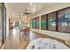 Expansive sunroom boasts natural light, a hot tub, and space for dining and relaxation at 1108 W Charter St, Tampa, FL 33602
