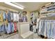Spacious walk-in closet with custom shelving, hanging rods, and drawers for optimal organization and storage at 1108 W Charter St, Tampa, FL 33602