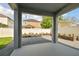 View of the backyard's gravel area, planter boxes, and fenced perimeter at 1571 Montgomery Bell Rd, Wesley Chapel, FL 33543