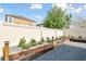 A backyard featuring gravel landscaping with raised planters and privacy fence at 1571 Montgomery Bell Rd, Wesley Chapel, FL 33543