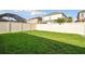 Manicured backyard featuring lush green grass, perfect for outdoor enjoyment and entertaining at 1571 Montgomery Bell Rd, Wesley Chapel, FL 33543