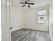 This bedroom has wood-look flooring and a window at 1571 Montgomery Bell Rd, Wesley Chapel, FL 33543