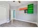 Charming bedroom featuring wood-look floors, built-in shelving, and a neutral color palette at 1571 Montgomery Bell Rd, Wesley Chapel, FL 33543