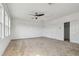 Spacious bonus room with carpet, ceiling fan, natural light, and closet at 1571 Montgomery Bell Rd, Wesley Chapel, FL 33543