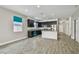 Stylish kitchen with dark cabinetry, stainless steel appliances, and a center island at 1571 Montgomery Bell Rd, Wesley Chapel, FL 33543