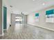 Spacious living room with tile flooring, sliding glass doors, and bright windows at 1571 Montgomery Bell Rd, Wesley Chapel, FL 33543