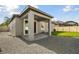 Outdoor patio with concrete flooring and gravel landscaping for low maintenance at 1571 Montgomery Bell Rd, Wesley Chapel, FL 33543