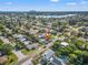 Aerial view of neighborhood with mature trees and waterways in the distance at 1600 Connecticut Ne Ave, St Petersburg, FL 33703