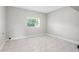 Bright, empty bedroom with tile floors, and a window at 1600 Connecticut Ne Ave, St Petersburg, FL 33703
