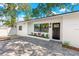 Inviting home showcasing black trim windows, a new front door, and a fresh exterior paint at 1600 Connecticut Ne Ave, St Petersburg, FL 33703