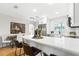 Bright, open kitchen features a white countertop island, modern appliances, and a subway tile backsplash at 1600 Connecticut Ne Ave, St Petersburg, FL 33703