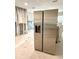 Modern stainless steel refrigerator and exposed kitchen studs ready for renovation with potential for updates at 1600 Connecticut Ne Ave, St Petersburg, FL 33703