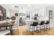 Bright and stylish kitchen with stainless steel appliances, white cabinets, and a breakfast bar at 1600 Connecticut Ne Ave, St Petersburg, FL 33703