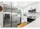 Modern kitchen featuring stainless steel appliances, white subway tile, and ample counter space at 1600 Connecticut Ne Ave, St Petersburg, FL 33703
