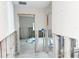 Open living space, ready for renovation, with exposed studs leading into another room at 1600 Connecticut Ne Ave, St Petersburg, FL 33703