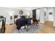 A spacious main bedroom featuring a king bed, stylish decor, and a sliding barn door to the bathroom at 1600 Connecticut Ne Ave, St Petersburg, FL 33703