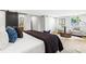 A spacious main bedroom featuring a king bed, stylish decor, and a seating area with a window at 1600 Connecticut Ne Ave, St Petersburg, FL 33703