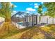 Exterior of screened-in pool with a lovely waterfall feature and modern design at 1600 Connecticut Ne Ave, St Petersburg, FL 33703