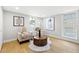 Cozy sitting room with hardwood floors, stylish furniture, and bright natural light at 1600 Connecticut Ne Ave, St Petersburg, FL 33703