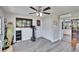 Functional bonus room with entertainment and exercise equipment, and an open doorway to the kitchen at 1623 San Mateo Dr, Dunedin, FL 34698