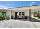 Inviting front porch with comfortable seating, decorative plants, and stylish accents at 1623 San Mateo Dr, Dunedin, FL 34698