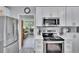 Modern kitchen with stainless steel appliances and ample counter space at 1623 San Mateo Dr, Dunedin, FL 34698