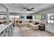 Comfortable living room with large sectional sofa and natural light at 1623 San Mateo Dr, Dunedin, FL 34698