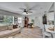 Inviting living room with a comfortable sofa, ample natural light, and stylish decor at 1623 San Mateo Dr, Dunedin, FL 34698