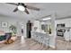 Open living space with breakfast bar, neutral walls and views of the kitchen at 1623 San Mateo Dr, Dunedin, FL 34698