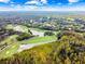 Scenic aerial shot of a golf course community with lush greens and sparkling lakes at 17003 Madres De Avila, Tampa, FL 33613