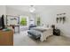 Cozy bedroom with a window seat, desk, and a comfortable bed with plush pillows at 17003 Madres De Avila, Tampa, FL 33613