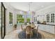 Bright breakfast nook with a view of the pool and access to built-in kitchen storage at 17003 Madres De Avila, Tampa, FL 33613