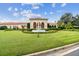 Impressive estate featuring manicured landscaping and a grand fountain as the focal point at 17003 Madres De Avila, Tampa, FL 33613