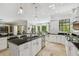 Gourmet kitchen boasting granite counters, stainless appliances, and plenty of natural light at 17003 Madres De Avila, Tampa, FL 33613