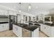 Spacious kitchen features granite countertops, stainless steel appliances and white cabinetry at 17003 Madres De Avila, Tampa, FL 33613