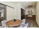 Outdoor kitchen and dining area with a built-in grill and bar at 17003 Madres De Avila, Tampa, FL 33613
