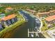 Aerial view of a waterfront condominium community with a marina, boat docks, and water access at 1720 Mariner Way, Tarpon Springs, FL 34689