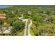 Scenic aerial view of a gated community with lush landscaping, mature trees and beautiful homes at 1720 Mariner Way, Tarpon Springs, FL 34689