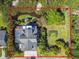 Aerial view of property, showcasing its expansive grounds, surrounding foliage, and proximity to water at 1720 Mariner Way, Tarpon Springs, FL 34689