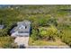 Wide aerial shot showcasing a coastal home with a garden and proximity to beautiful scenery at 1720 Mariner Way, Tarpon Springs, FL 34689