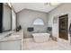 The soothing bathroom boasts a soaking tub and an elegant walk-in shower at 1720 Mariner Way, Tarpon Springs, FL 34689