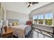 This bedroom offers bright natural light, hard wood floors, and a scenic view at 1720 Mariner Way, Tarpon Springs, FL 34689
