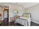 Comfortable bedroom features a decorative mirror over a wood table and a wrought iron bed frame at 1720 Mariner Way, Tarpon Springs, FL 34689