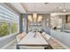 Formal dining room adjacent to the kitchen with large windows and natural light at 1720 Mariner Way, Tarpon Springs, FL 34689
