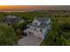 Stunning coastal home with a spacious porch overlooking lush greenery and distant ocean views at 1720 Mariner Way, Tarpon Springs, FL 34689