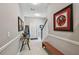 Inviting hallway features a decorative console table, bench seating, and appealing artwork at 1720 Mariner Way, Tarpon Springs, FL 34689