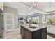 Beautiful kitchen with island featuring granite countertops and stainless steel faucet at 1720 Mariner Way, Tarpon Springs, FL 34689