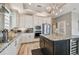 Well-equipped kitchen with granite countertops, stainless steel appliances and a kitchen island at 1720 Mariner Way, Tarpon Springs, FL 34689